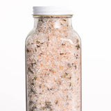 Bright Endeavors 16 oz lavender bath salts in a clear jar with a purple lid, showing lavender flowers and salt crystals inside.