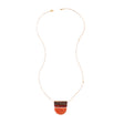 Belgrano Necklace in orange rust by Faire Collection featuring a stylish, handcrafted jewelry design with vibrant color.