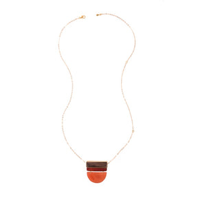 Belgrano Necklace in orange rust by Faire Collection featuring a stylish, handcrafted jewelry design with vibrant color.