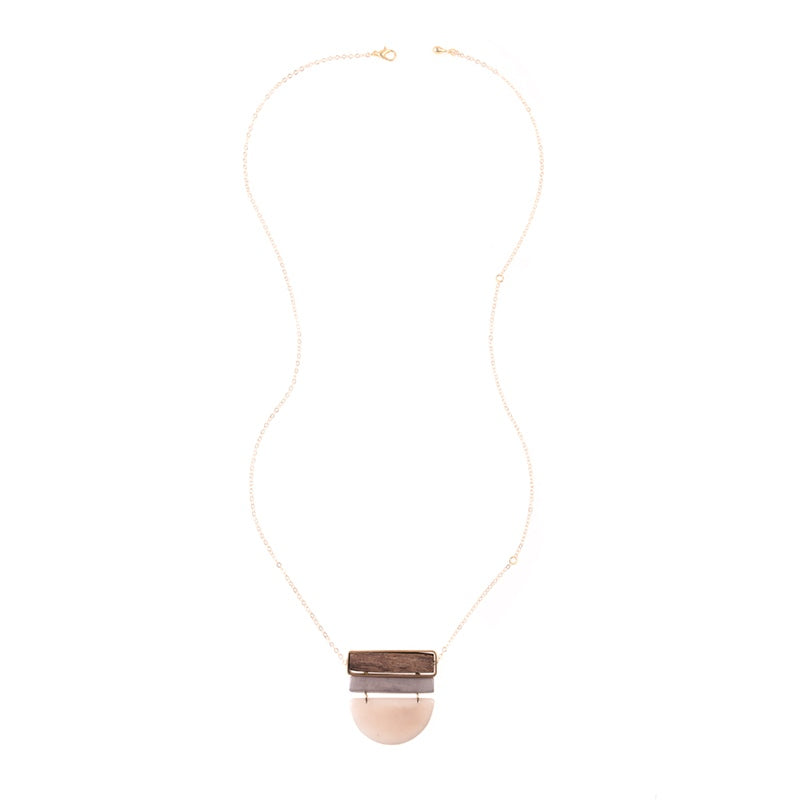 Elegant Belgrano Necklace in sand color featuring layered gold-tone chains, from Faire Collection.