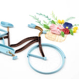 Quilling Card features a bicycle with a flower basket, showcasing intricate paper quilling art design.