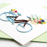 Elegant quilling card featuring a bicycle and floral basket design from Quilling Card, showcasing intricate paper art.