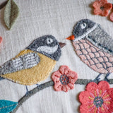 Natural Habitat Bird Flock embroidered pillow featuring colorful bird designs, 12x20 inches, decorative home accessory.
