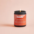 Kandu Blood Orange Vetiver 8oz glass candle with orange and green wax, featuring a textured label and a natural cotton wick.