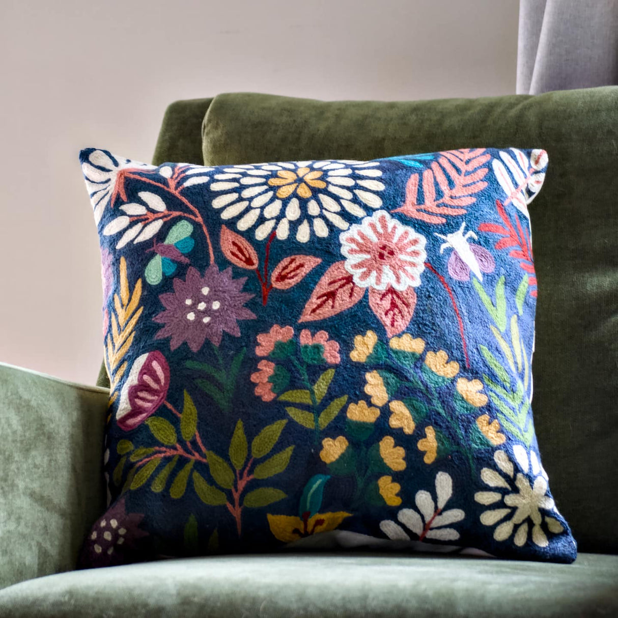 Botanical navy 18-inch chainstitch pillow featuring embroidered floral design on soft fabric.