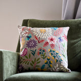 Botanical 18-inch chainstitch pillow in sandy tones, featuring floral embroidery on soft fabric.