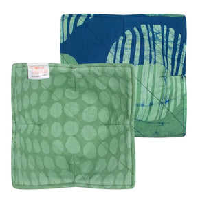 Global Mamas eclipse green bowl cozy featuring soft fabric and cozy design for protecting hands and surfaces from hot bowls.