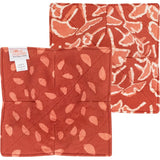 Ginkgo Rust bowl cozy showcasing warm, textured fabric design for protecting hands from hot bowls.