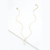 Brayden Pendant with Mother of Pearl by Starfish Project featuring a round iridescent shell and gold-tone chain.