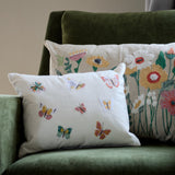 Embroidered pillow featuring colorful butterfly designs, 12x16 inches, by Natural Habitat, with detailed butterfly motifs on soft fabric.