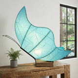 Blue butterfly table lamp by Eangee with detailed butterfly design and decorative base on a neutral background.