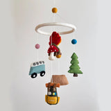 Ganapati camping felt mobile with colorful felt shapes hanging from a wooden frame for decorative outdoor use