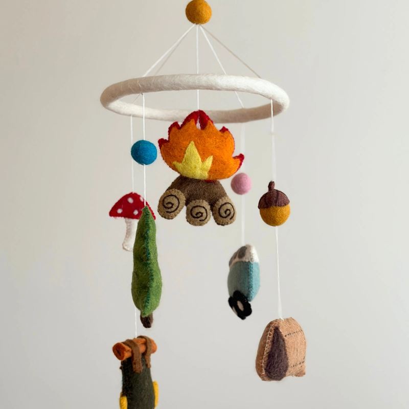 Ganapati Camping Felt Mobile with colorful felt animals and shapes hanging from a wooden frame, ideal for outdoor or camping decor.