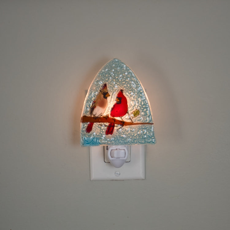 Pampeana Cardinal Couple Night Light with red cardinal bird design illuminating a cozy bedroom space