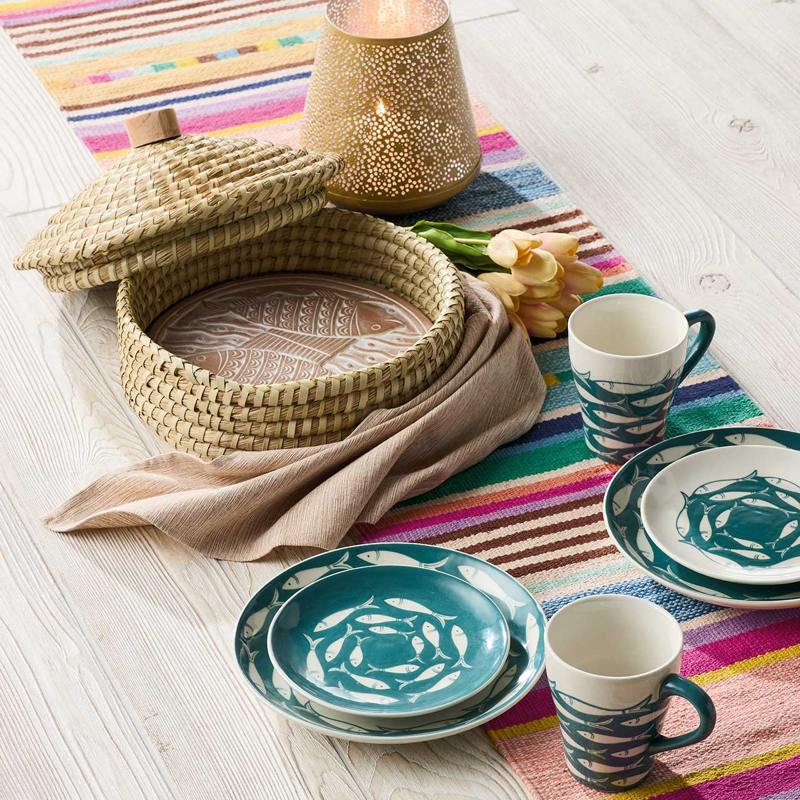 Serrv Catch of the Day lidded bread warmer with a woven basket design, perfect for keeping bread warm and stylish.