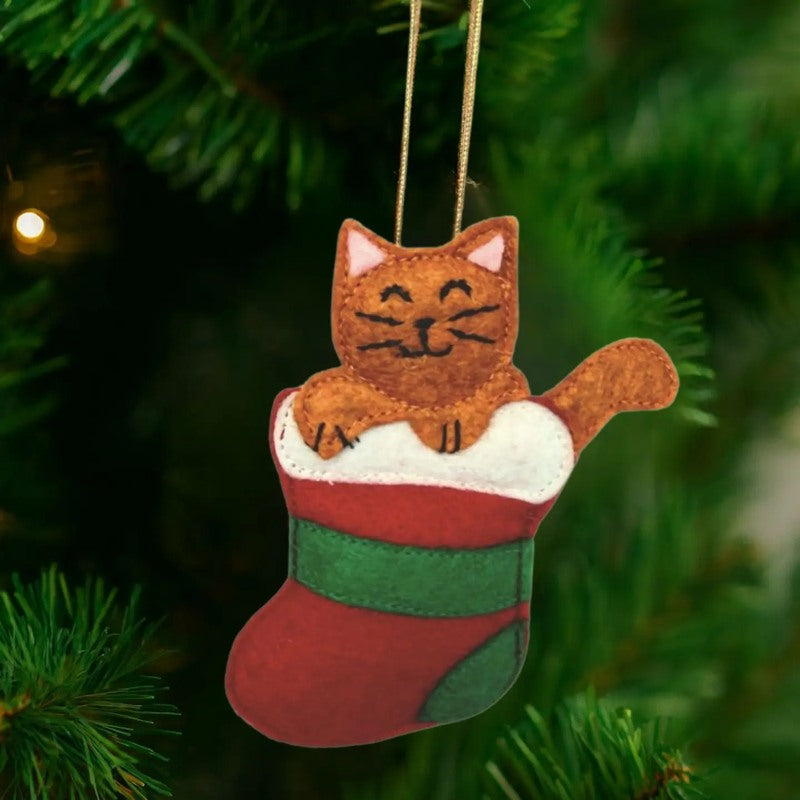 Upavim Caught in the Stocking Cat ornament featuring a detailed ceramic cat peeking out of a festive Christmas stocking.