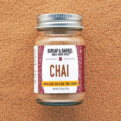 Burlap & Barrel chai spice blend featuring a mix of cinnamon, ginger, cardamom, and cloves in a glass jar.