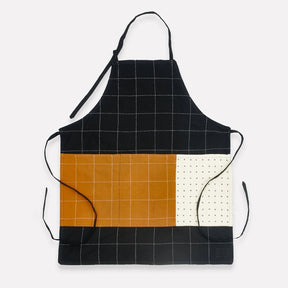 Anchal charcoal organic cotton bib apron with adjustable neck strap and front pocket, ideal for cooking or crafting.