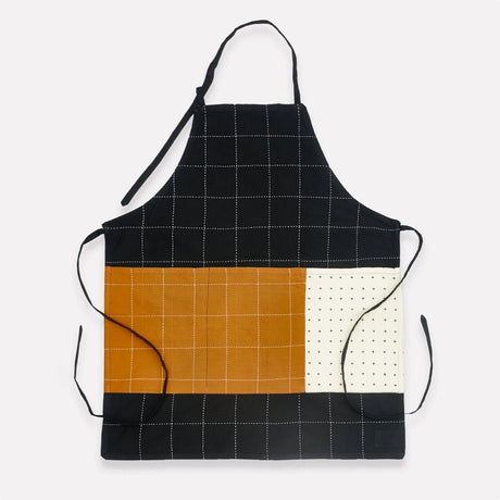 Anchal charcoal organic cotton bib apron with adjustable neck strap and front pocket, ideal for cooking or crafting.