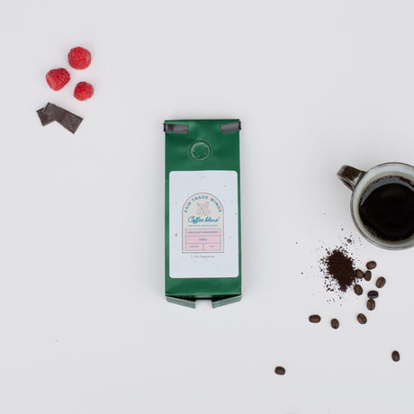 Louisiana Roasting Company Chocolate Raspberry coffee grounds in a 4 oz bag, showcasing rich chocolate and raspberry flavor notes.