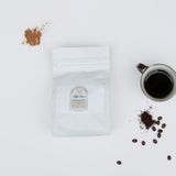 Louisiana Roasting Company cinnamon roll flavored whole bean coffee in a 10 oz bag, aromatic and perfect for brewing rich, flavorful coffee.