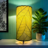 Green Cocoa Leaf Cylinder Table Lamp by Eangee, 12-inch tall decorative lamp with leaf design and textured surface.