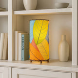 Eangee Cocoa Leaf Cylinder Table Lamp, 12-inch multi-colored design with cocoa leaf pattern on a sleek base.