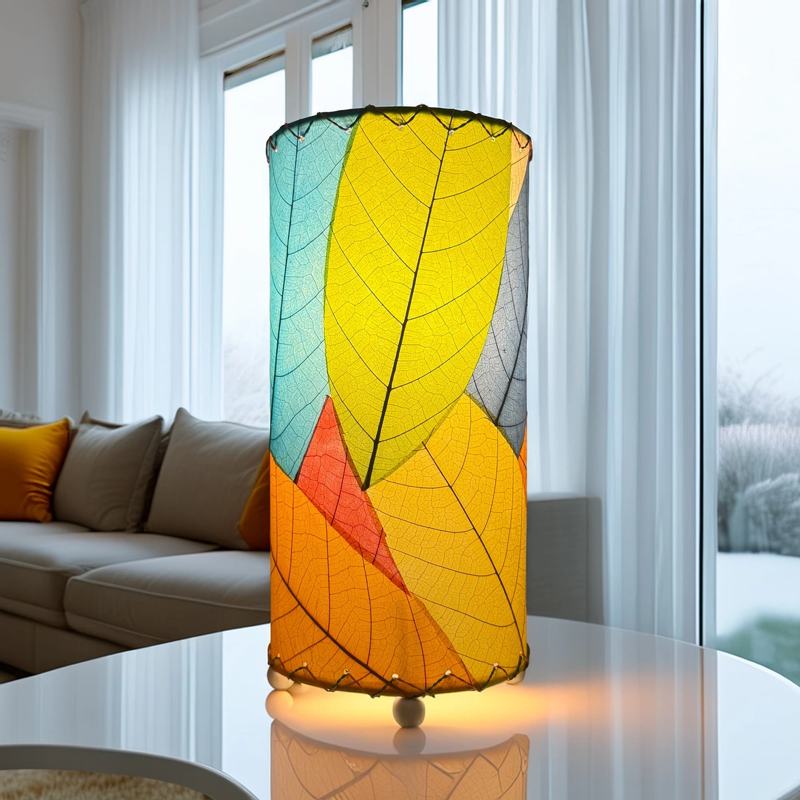 Eangee Cocoa Leaf Cylinder Table Lamp, 12-inch multi-colored design with leaf pattern, on a wooden table.