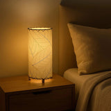 Eangee Cocoa Leaf Cylinder Table Lamp in natural finish, 12-inch height with leaf-shaped shade, ideal for ambient lighting.