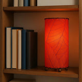 Red Cocoa Leaf Cylinder Table Lamp by Eangee, 12-inch tropical-inspired ceramic lamp with detailed leaf design.