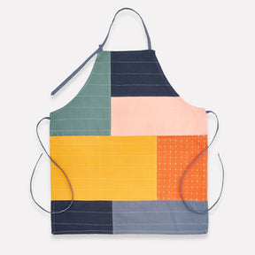 Anchal colorblock organic cotton bib apron with a stylish design, adjustable neck strap, and functional front pocket for cooking or gardening.