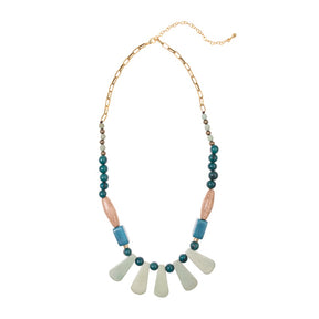 Dewkist Cordoba Necklace by Faire Collection featuring layered silver chains and intricate pendant design.