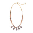 Cordoba Necklace by Faire Collection featuring an elegant gray opal pendant on a delicate chain.