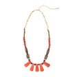 Faire Collection Cordoba Necklace in vibrant orange rust with intricate beaded design and adjustable cord for a stylish look.