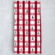 Red and green plaid cotton tea towel featuring trees, perfect for adding a festive touch to kitchen decor.