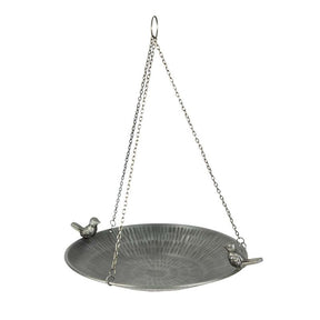 Metal bird bath with chain on a white background