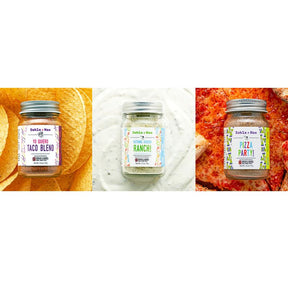 Three jars of spices with different blends on a white background