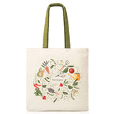 Tote bag with gardening-themed design and 'free to grow' text on a white background