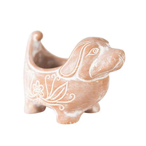 Ceramic dog-shaped planter with decorative patterns on a white background