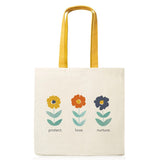 Tote bag with floral designs and text on a white background