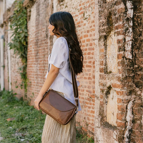 Joyn Alisha crossbody bag in heritage brown leather with adjustable strap and sleek design.