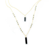 Allie Necklace in cool gray from Faire Collection featuring a slim chain and minimalist pendant for a modern, elegant look.
