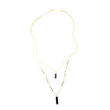 Faire Collection Allie Necklace with a smooth, cool gray pendant on a delicate chain, modern jewelry accessory for stylish looks.