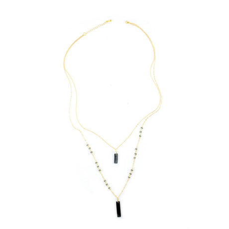 Faire Collection Allie Necklace with a smooth, cool gray pendant on a delicate chain, modern jewelry accessory for stylish looks.