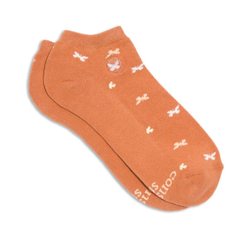 Pair of Conscious Step ankle socks featuring butterfly designs symbolizing support to stop violence against women.