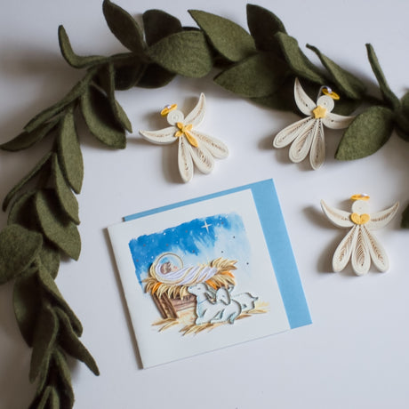 Baby Jesus in Manger Quilling Card featuring detailed paper quilling artwork depicting the nativity scene.