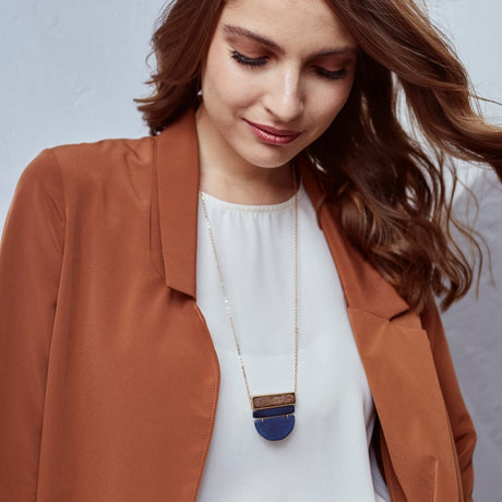 Faire Collection Belgrano Necklace in vibrant orange rust with intricate pendant design, perfect for stylish accessories.