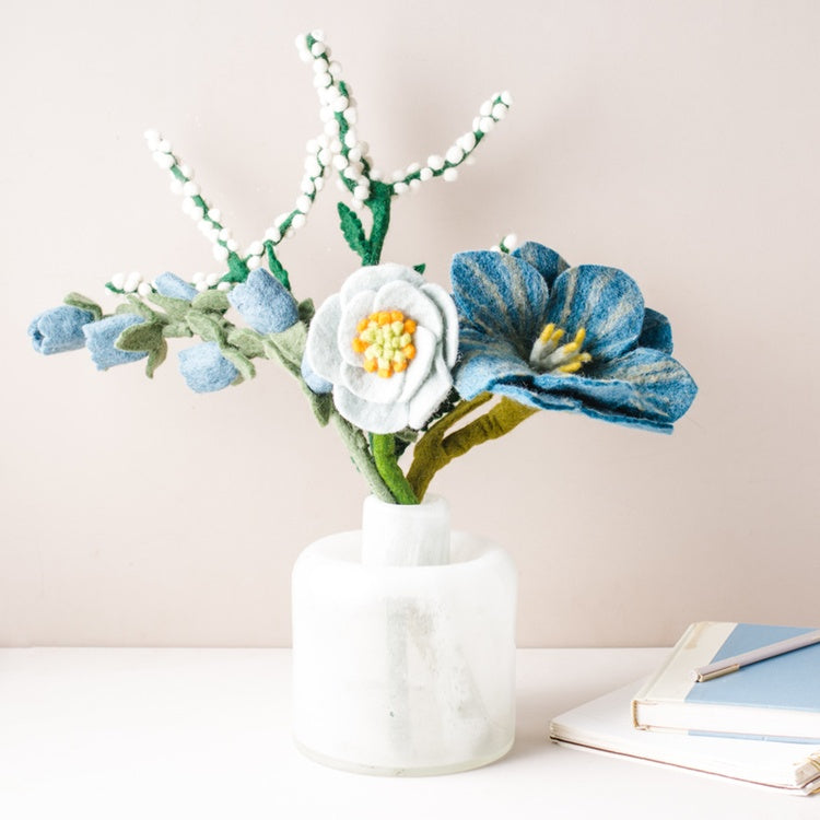 Colorful felt flower bouquet with blue, pink, and yellow blooms from Fair Trade Winds, arranged in a charming display.
