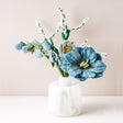Colorful felt flower bouquet featuring vibrant blue and yellow blooms, handcrafted for Fair Trade Winds