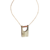 Faire Collection Bridge Pendant featuring a sleek, modern design with a polished metal finish and intricate bridge detailing.